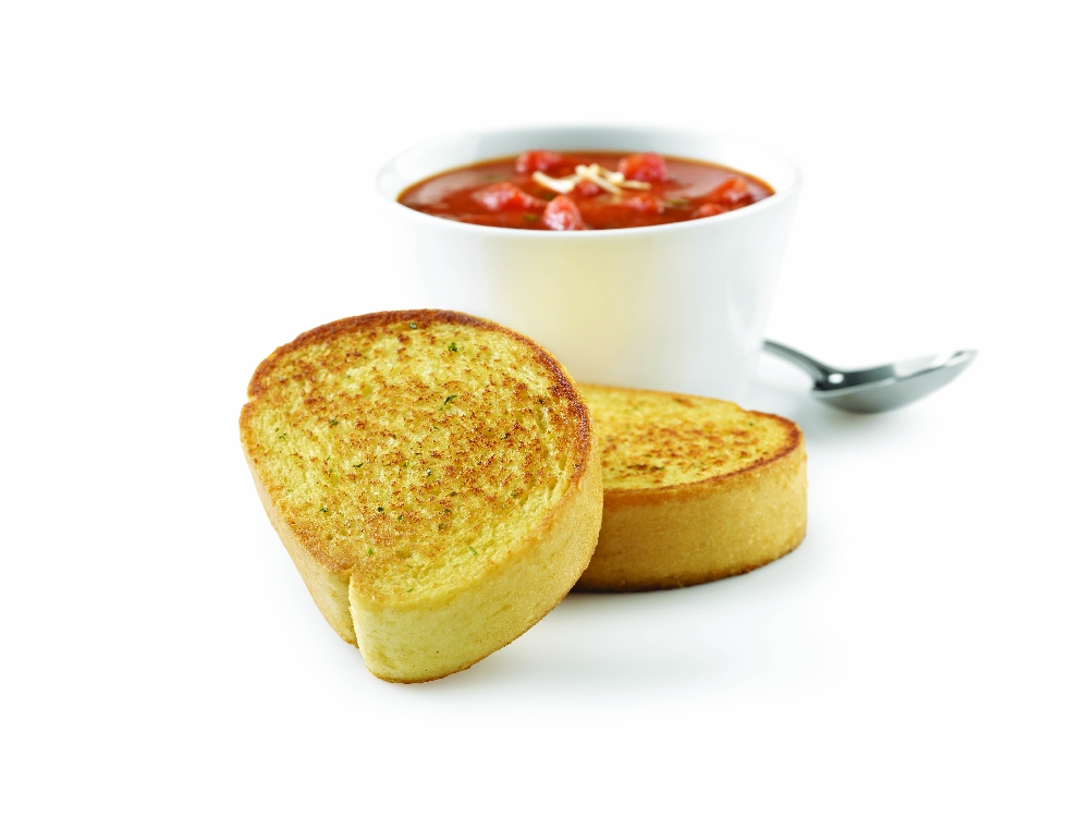2 slices of Baker Boy Garlic Toast next to Soup